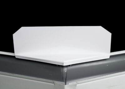 A white box sitting on top of a black surface.